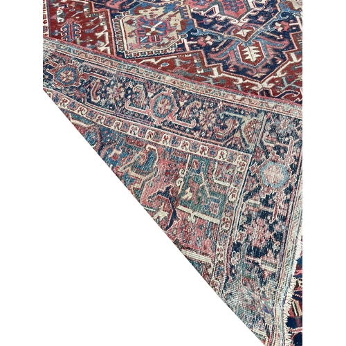 94 - ANTIQUE PERSIAN HERIZ CARPET, 345cm x 245cm.