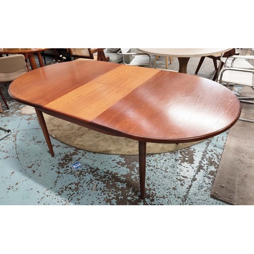 357 - G PLAN EXTENDING DINING TABLE, 1970s, teak, the top sliding out reveal extra leaf, raised on turned ... 