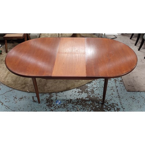 357 - G PLAN EXTENDING DINING TABLE, 1970s, teak, the top sliding out reveal extra leaf, raised on turned ... 