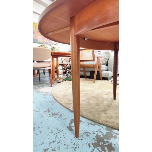 357 - G PLAN EXTENDING DINING TABLE, 1970s, teak, the top sliding out reveal extra leaf, raised on turned ... 