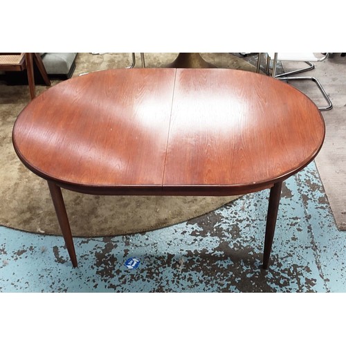 357 - G PLAN EXTENDING DINING TABLE, 1970s, teak, the top sliding out reveal extra leaf, raised on turned ... 