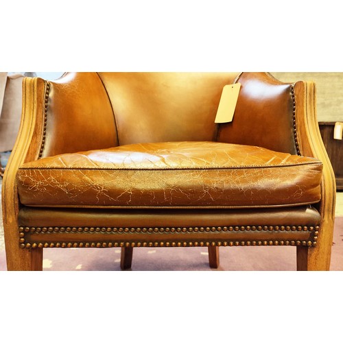 139 - A BERGERE CHAIR, mid 20th century, brown leather upholstered mahogany arms and legs, 82cm H x 62cm 