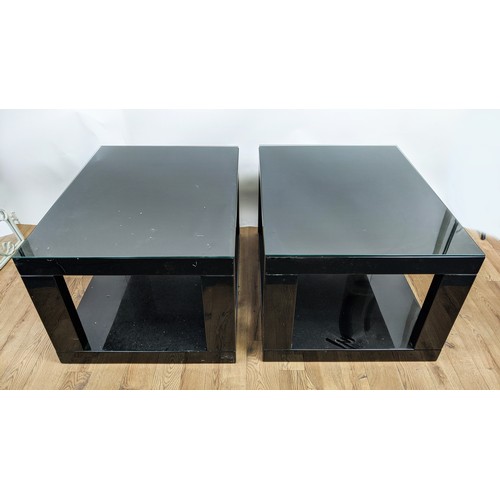 306 - LOW TABLES, a pair, black lacquered with glass tops, 85cm x 65cm x 51cm. (2)