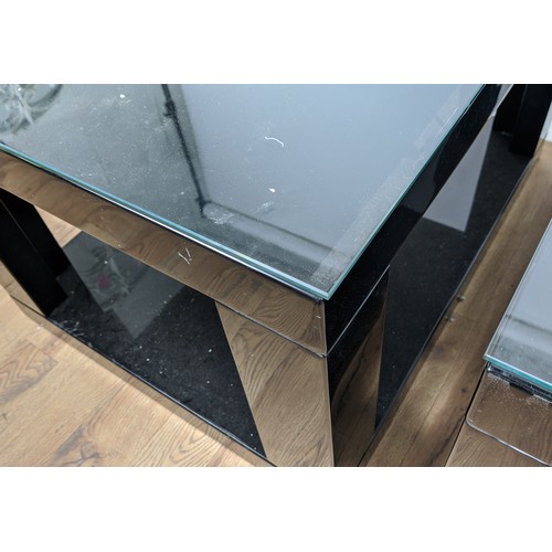 306 - LOW TABLES, a pair, black lacquered with glass tops, 85cm x 65cm x 51cm. (2)