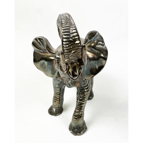 21 - SILVER CLAD ELEPHANT, marked 925, 28cm L x 25cm H.