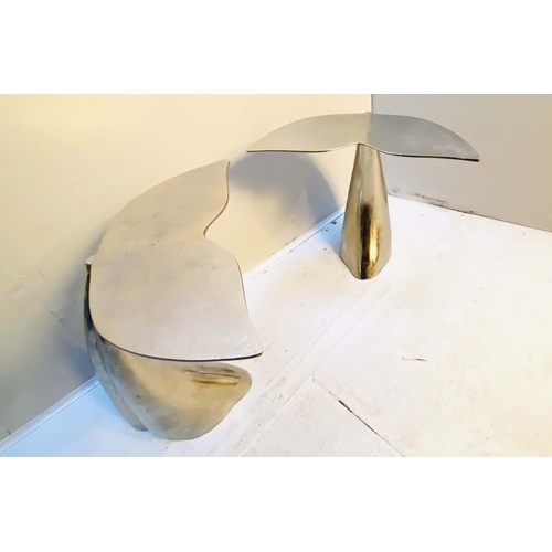 507 - SIDE TABLES, a pair, 55cm high, 54cm wide, 44cm deep, in the form of whale tails polished metal. (2)