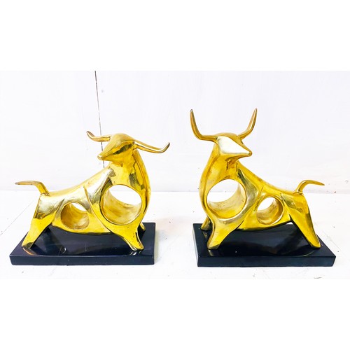 509 - SCULPTURAL CAST BRONZE BULLS, a set of two, each raised on black marble bases, 19cm high, 25cm wide,... 