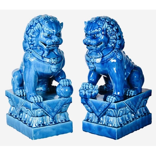 511 - FOO DOGS, a pair, 40cm high, 15cm wide, 25cm deep, cobalt blue glazed ceramic. (2)