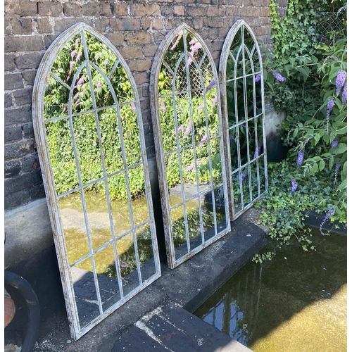 512 - ARCHITECTURAL GARDEN MIRRORS, set of three, 160cm high, 67cm wide, Gothic style with overlaid glazin... 