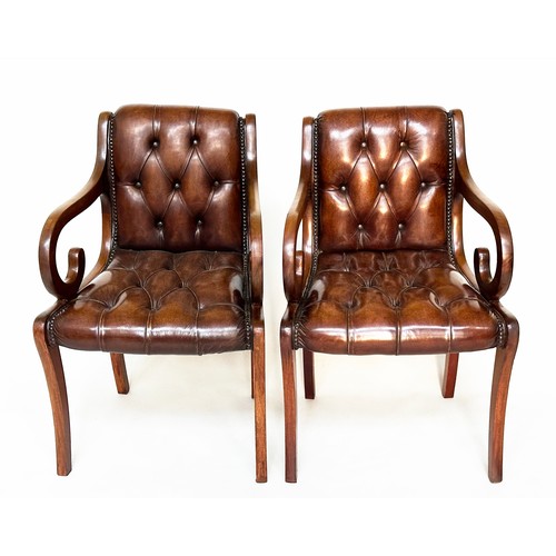 121A - ARMCHAIRS, a pair, Regency style mahogany with buttoned mid brown leather upholstery and scroll arms... 