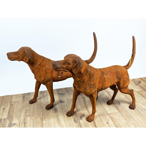 305 - CONTEMPORARY SCHOOL SCULPTURAL DOGS, a pair, cast metal, oxidised finish, 91cm x 21cm x 75cm. (2)