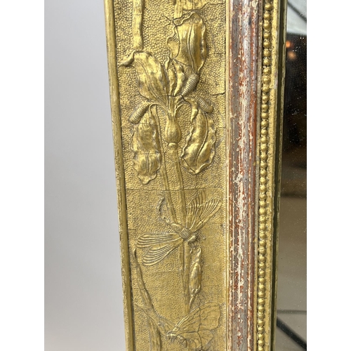 198 - WALL MIRROR, 19th century gilt gesso incorporating stylised foliate plants, dragonflies and entwined... 