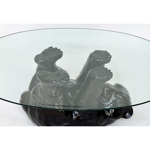 208 - BEAR TABLE, oval plate glass with bear cub support, 114cm x 80cm x 45cm H.