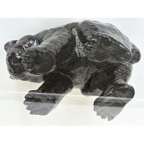 208 - BEAR TABLE, oval plate glass with bear cub support, 114cm x 80cm x 45cm H.