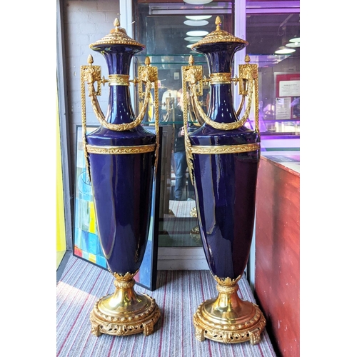 421 - FLOOR STANDING URNS, a pair, Sevres style, blue ceramic with gilt metal mounts, 135cm H each. (2)