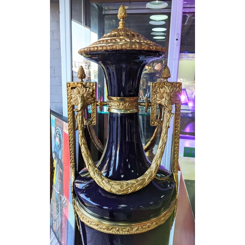 421 - FLOOR STANDING URNS, a pair, Sevres style, blue ceramic with gilt metal mounts, 135cm H each. (2)