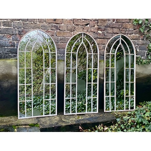 391 - ARCHITECTURAL GARDEN MIRRORS, a set of three, Gothic style frames, distressed finish. (3)