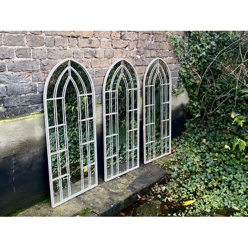 391 - ARCHITECTURAL GARDEN MIRRORS, a set of three, Gothic style frames, distressed finish. (3)