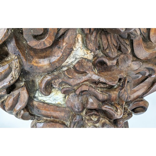 143 - WALL MOUNTED BRACKETS, a pair, hand carved in the Rococo style, with plinth tops supported by scroll... 