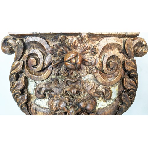 143 - WALL MOUNTED BRACKETS, a pair, hand carved in the Rococo style, with plinth tops supported by scroll... 