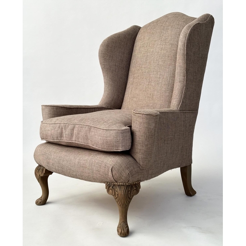 106 - WINGBACK ARMCHAIRS, a pair, Queen Anne style with natural linen upholstery and carved walnut cabrile... 