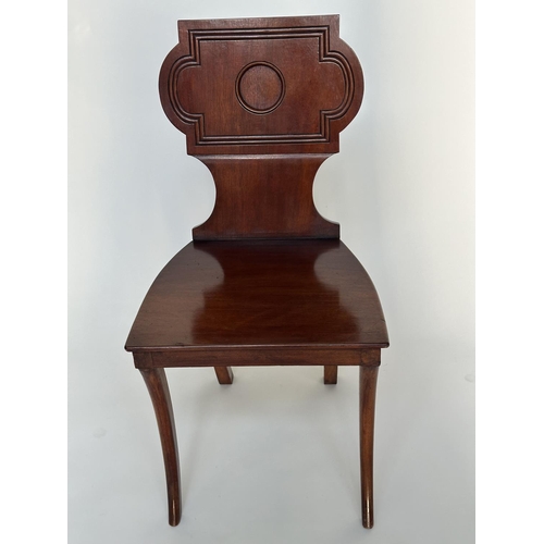 121 - HALL CHAIRS, a pair, Regency style mahogany with cartouche inset backs and sabre front supports, 44c... 