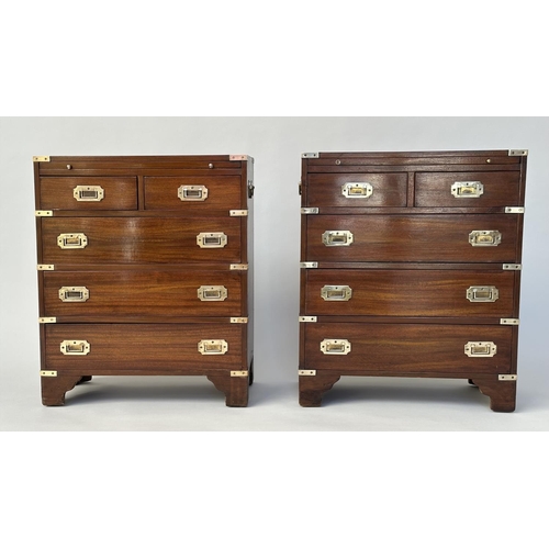 122 - CAMPAIGN STYLE CHESTS, a pair, mahogany and brass bound each with brushing slide above two short and... 