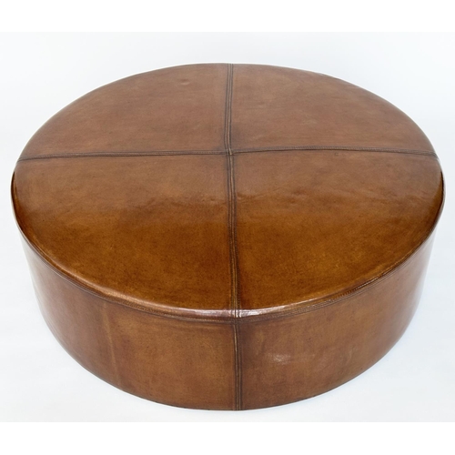 125 - CENTRE STOOL, circular stitched mid brown, natural leather with bun supports, 100cm W x 31cm H.