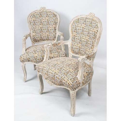 153 - FAUTEUILS, 93cm H x 64cm W, a pair, Louis XV style white painted in geometric upholstery. (2)