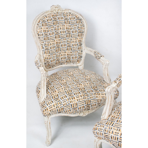 153 - FAUTEUILS, 93cm H x 64cm W, a pair, Louis XV style white painted in geometric upholstery. (2)