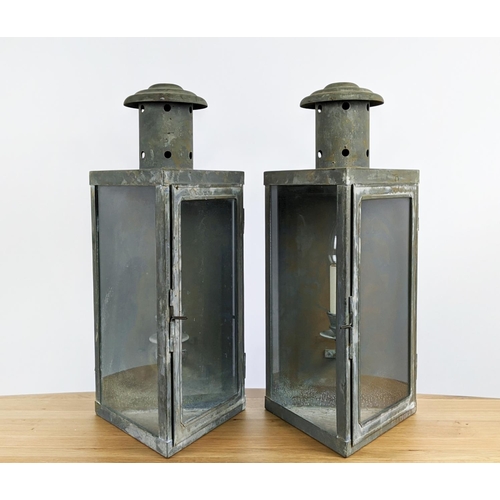 308 - WALL LANTERNS, a pair, aged metal and glass, 24.5cm x 21.5cm x 52cm approx each. (2)