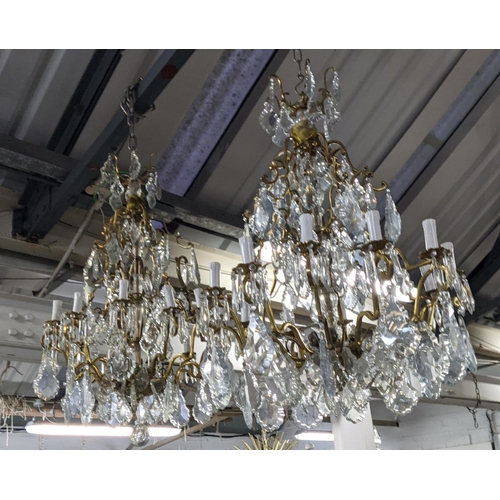 309 - CHANDELIERS, a near pair, each eighteen branch, cut glass, gilt metal, 100cm drop at largest. (2)