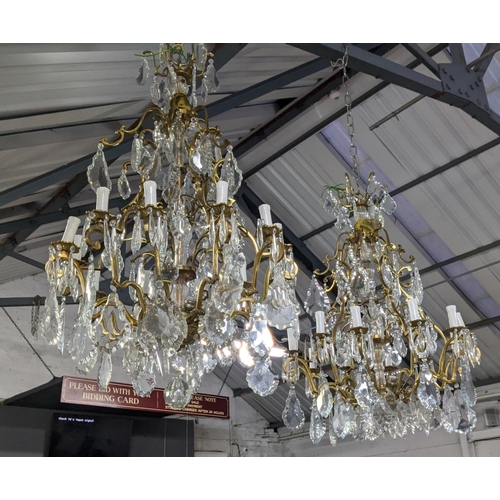 309 - CHANDELIERS, a near pair, each eighteen branch, cut glass, gilt metal, 100cm drop at largest. (2)