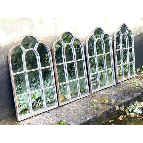 405 - ARCHITECTURAL GARDEN MIRRORS, a set of four aged metal frames, 61cm x 39cnm. (4)