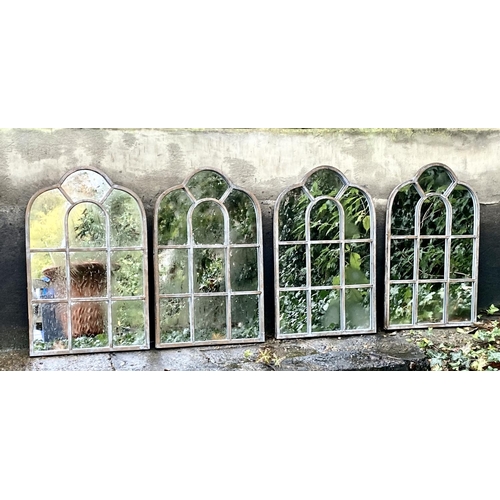 405 - ARCHITECTURAL GARDEN MIRRORS, a set of four aged metal frames, 61cm x 39cnm. (4)