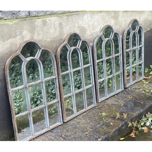 405 - ARCHITECTURAL GARDEN MIRRORS, a set of four aged metal frames, 61cm x 39cnm. (4)