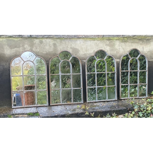 405 - ARCHITECTURAL GARDEN MIRRORS, a set of four aged metal frames, 61cm x 39cnm. (4)