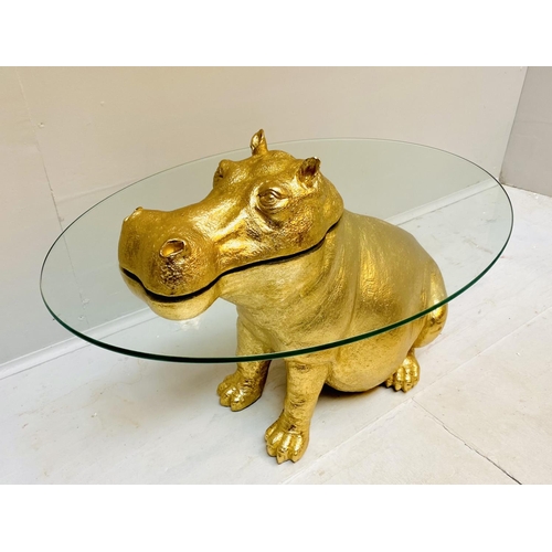 429 - HIPPOPOTAMUS LOW TABLE, gilt resin, glass top, 65cm x 45cm x 50cm.