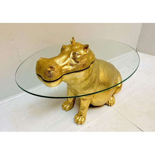 429 - HIPPOPOTAMUS LOW TABLE, gilt resin, glass top, 65cm x 45cm x 50cm.