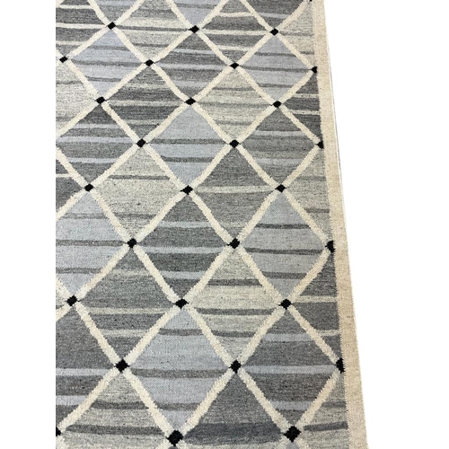 81 - FINE SWEDISH DESIGN KILIM, 304cm x 257cm.