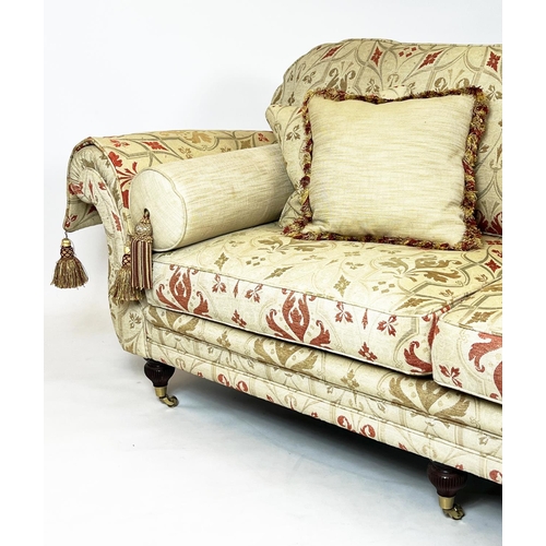 87 - SOFA, traditional style, three seater with ottoman design fabric, raised on six turned legs and bras... 