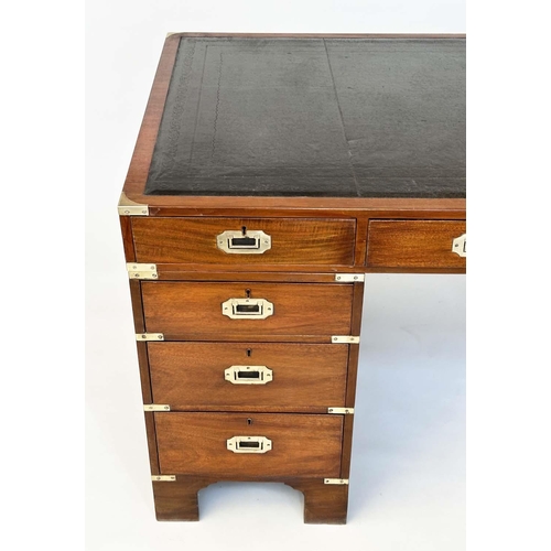 90 - CAMPAIGN STYLE DESK, mahogany and brass bound with tooled leather writing surface above nine drawers... 