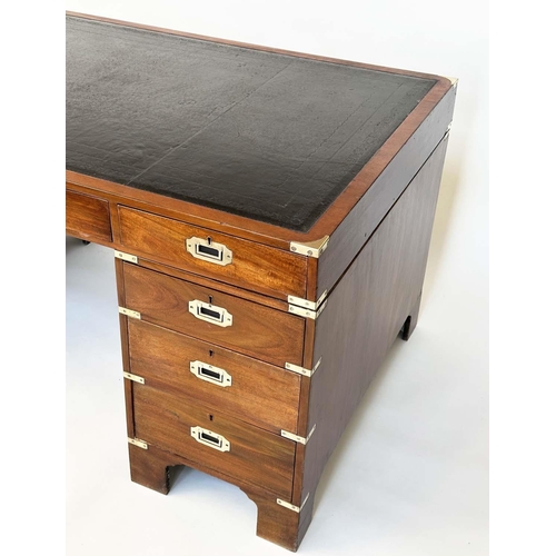 90 - CAMPAIGN STYLE DESK, mahogany and brass bound with tooled leather writing surface above nine drawers... 