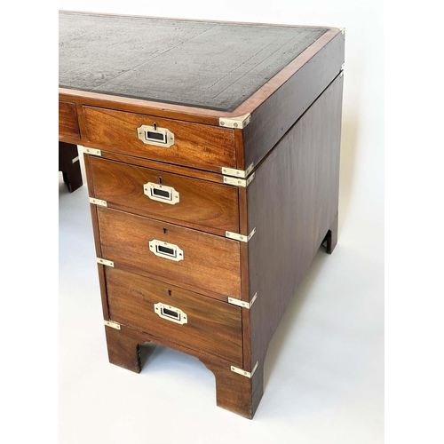 90 - CAMPAIGN STYLE DESK, mahogany and brass bound with tooled leather writing surface above nine drawers... 