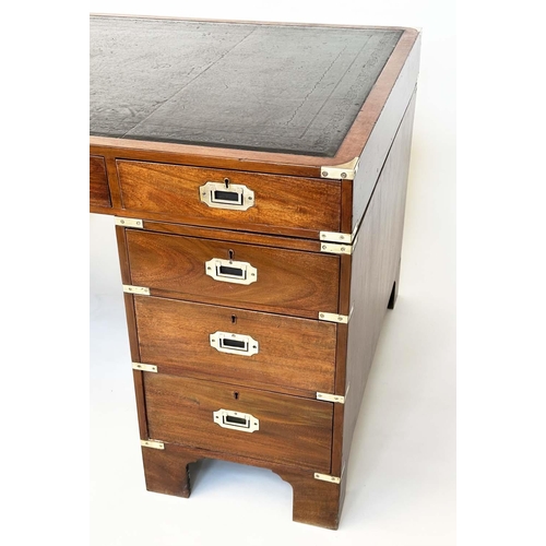 90 - CAMPAIGN STYLE DESK, mahogany and brass bound with tooled leather writing surface above nine drawers... 