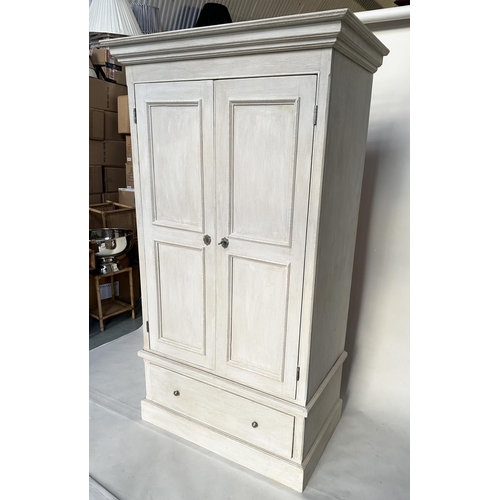 137 - ARMOIRE, French style traditionally grey painted with two panelled doors, enclosing hanging space ab... 