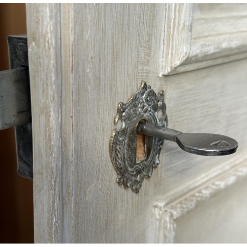 137 - ARMOIRE, French style traditionally grey painted with two panelled doors, enclosing hanging space ab... 