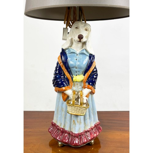 1 - FIGURAL LAMPS, a pair, dog caricatures modelled as a country squire and a shawled lady in multi colo... 