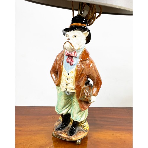 1 - FIGURAL LAMPS, a pair, dog caricatures modelled as a country squire and a shawled lady in multi colo... 