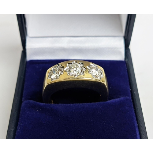 11 - A 9CT YELLOW GOLD GENTS THREE STONE DIAMOND RING, each in a star setting, total diamond weight of 1.... 